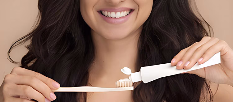Woman with toothbrush and toothpaste